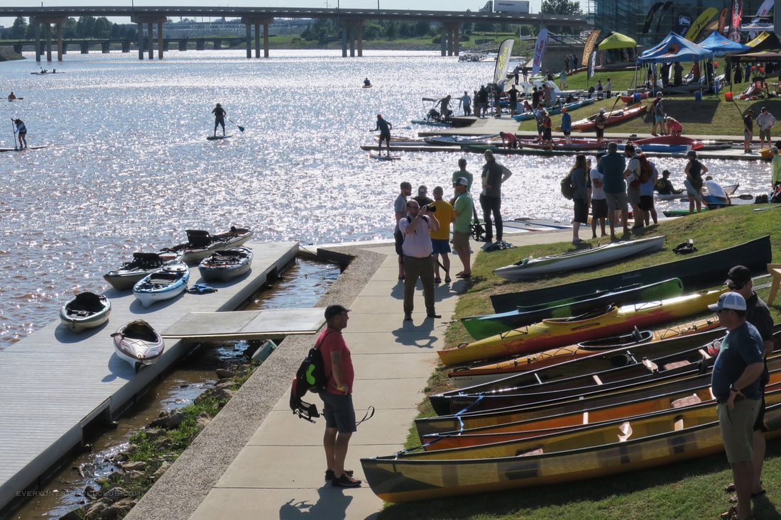 Retailers browsing kayaks at demo day at the Paddlesports Retailer Show in Oklahoma City, 2018
